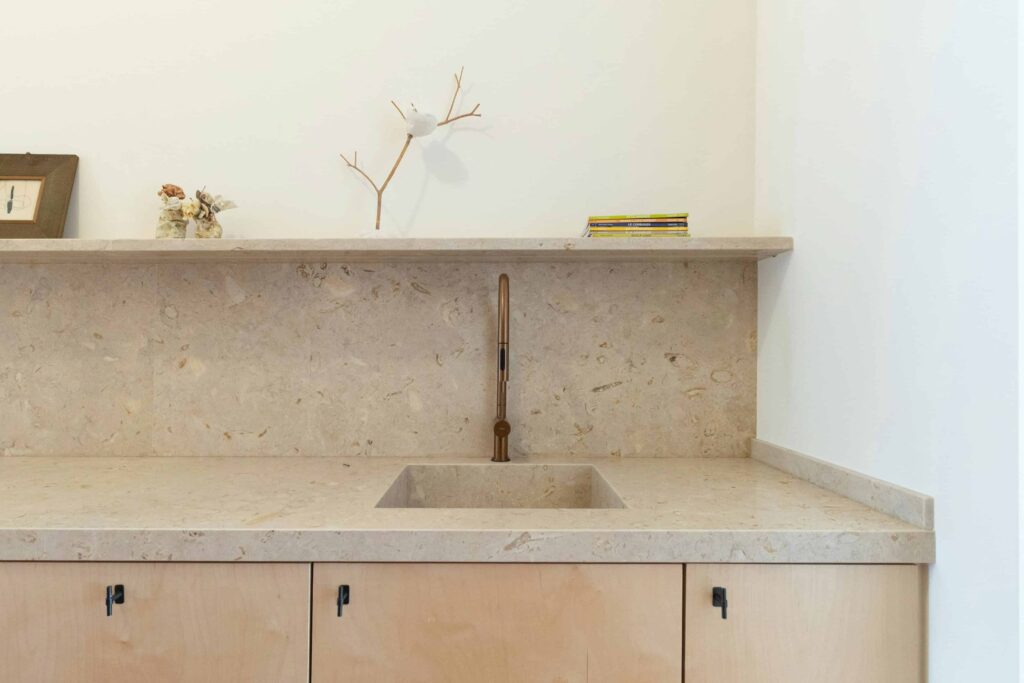Stone kitchen worktop featuring sink