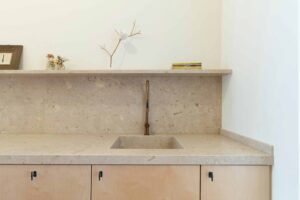 Stone kitchen worktop featuring sink